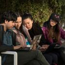 Group of Students Looking at Laptop